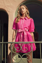 Hot pink babydoll dress with scallop trim accents